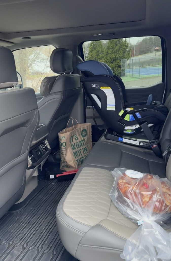 Britax car seat installed in the massive rear seat of the 2026 Ford F-250 Super Duty Platinum crew cab
