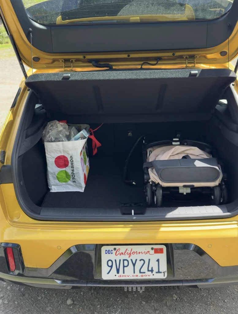 Stroller and groceries in the 2026 Kia K4 hatchback cargo area