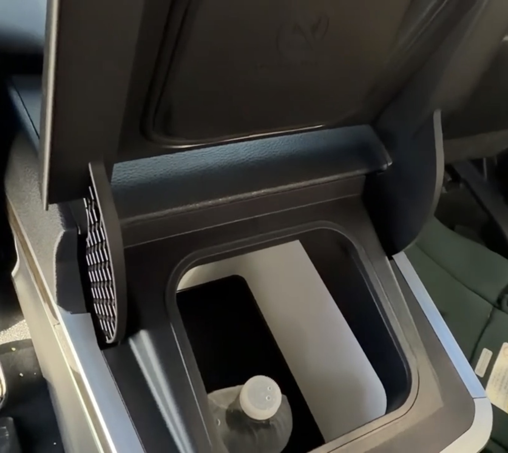 FridgeBox refrigerator open in the 2025 Toyota Sienna Platinum center console with a water bottle inside