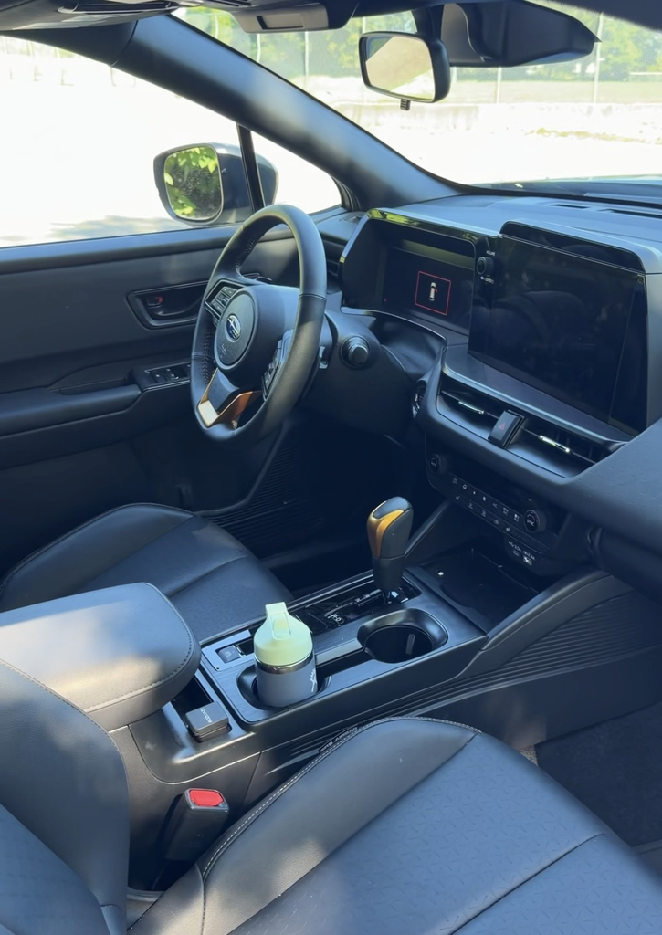 Driver area of the 2026 Subaru Outback Wilderness showing the portrait screen and copper shifter accent