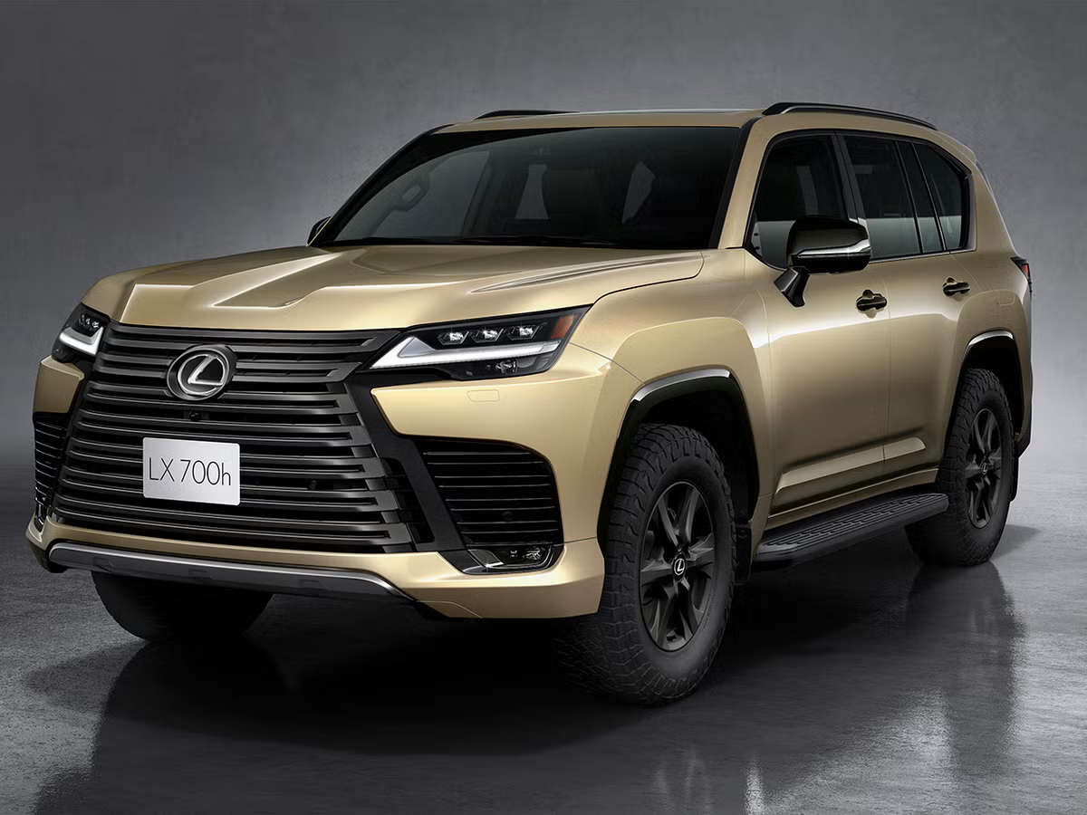 Gold Lexus LX 700h front three quarter studio shot