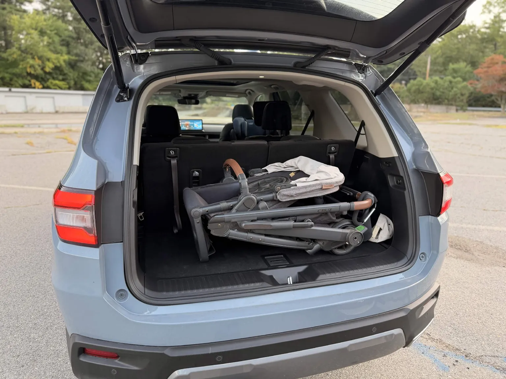 Folded UPPAbaby Cruz stroller fitting easily in the 2026 Honda Pilot cargo area with the third row down
