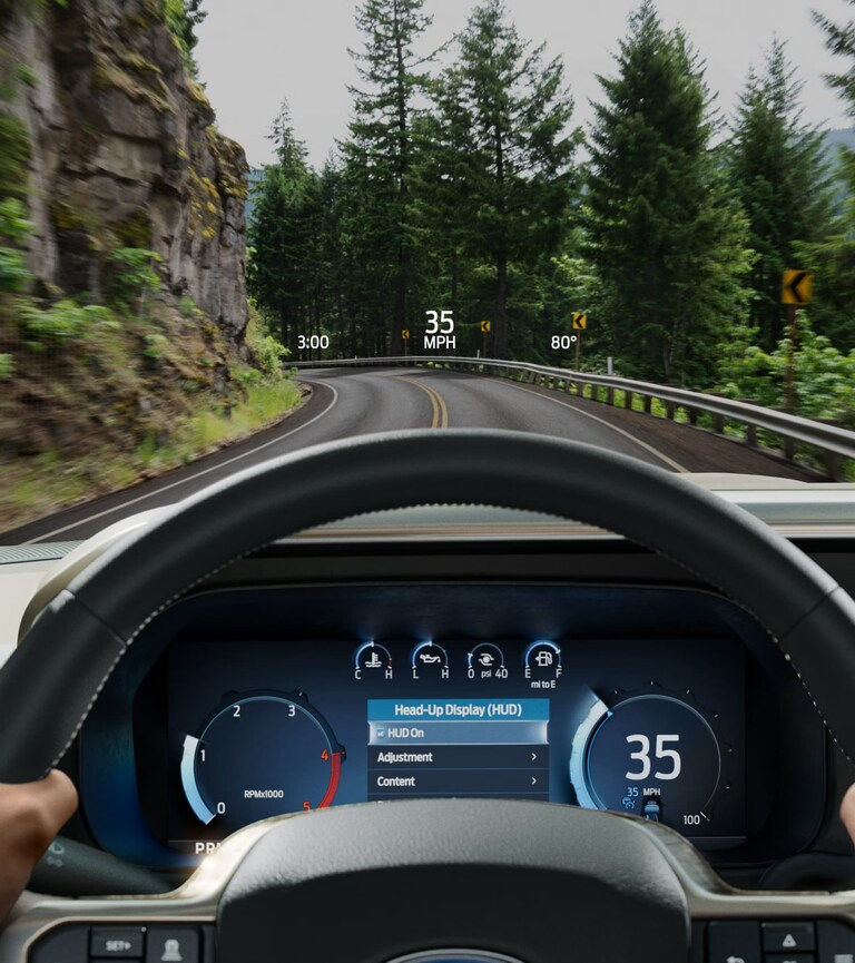 Head-up display view from the driver seat of the 2026 Ford F-250 Super Duty Platinum showing speed and navigation