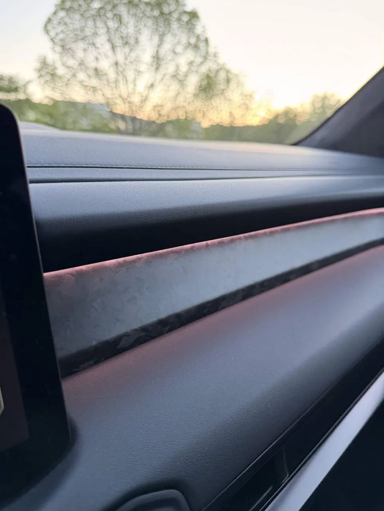 Engineered carbon dashboard trim detail in the 2027 Kia Telluride X-Pro at sunset