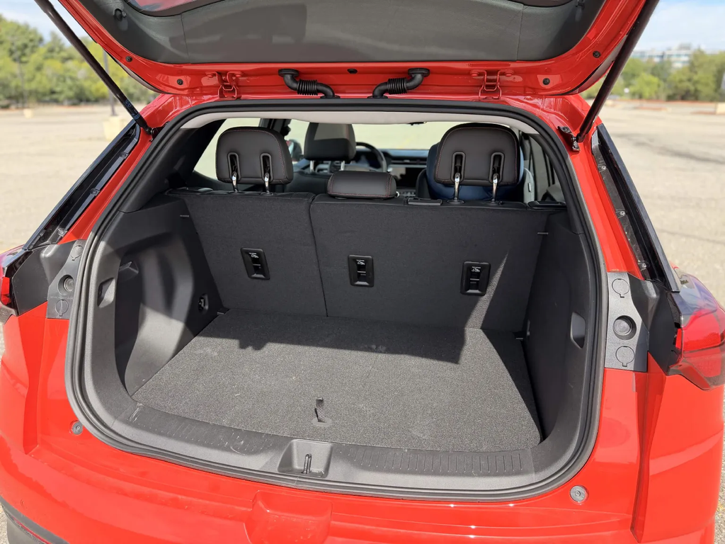 Trunk of the 2027 Chevrolet Bolt with the load floor in place, showing the deep cargo well