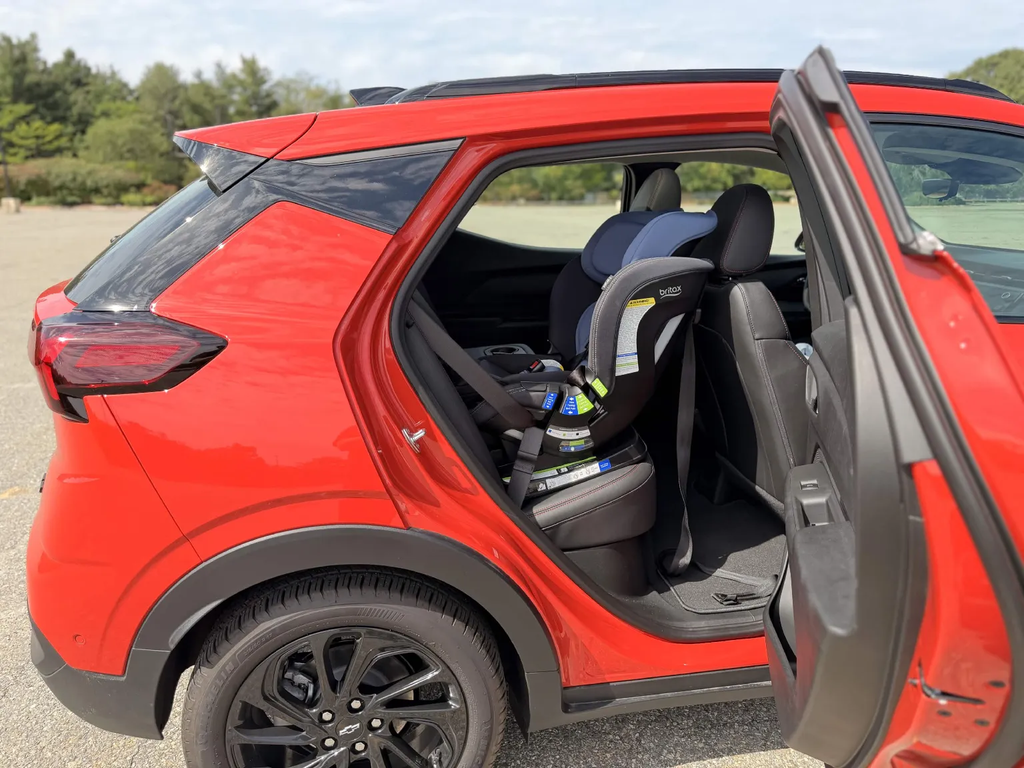 Britax Poplar S car seat installed in the back seat of the 2027 Chevrolet Bolt RS through the wide door opening