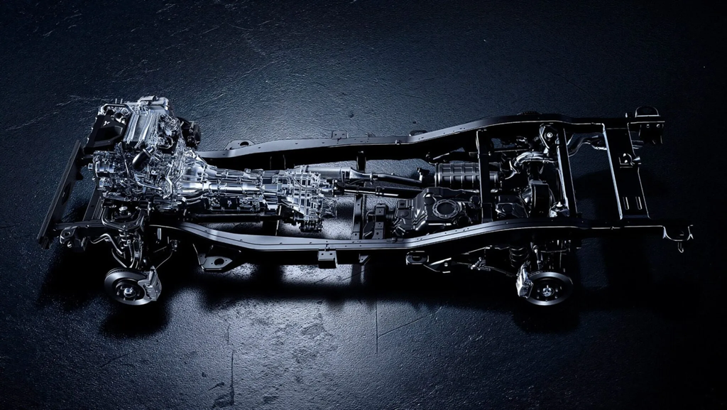 Ladder-frame chassis of the 2027 Mitsubishi Pajero shared with the Triton pickup, showing the drivetrain and five-link rear axle