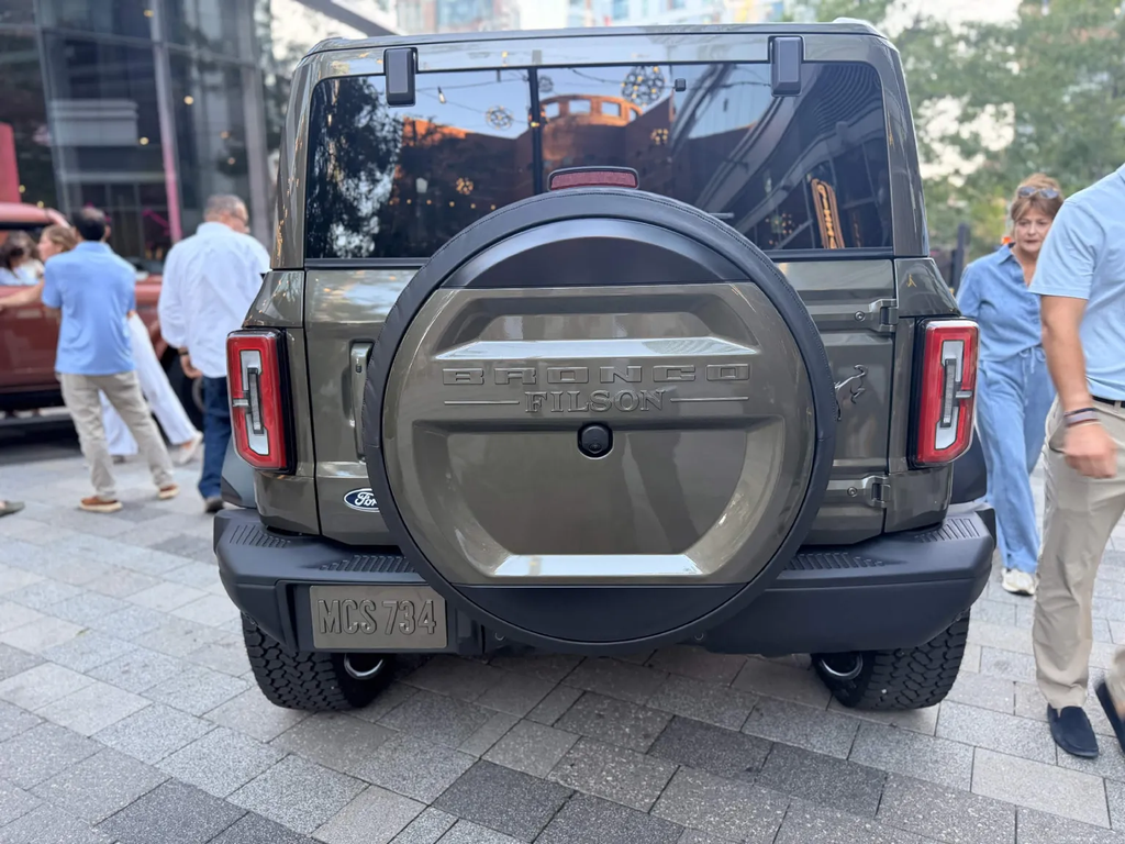Rear view of the green Bronco Filson showing the Bronco Filson embossed spare tire cover