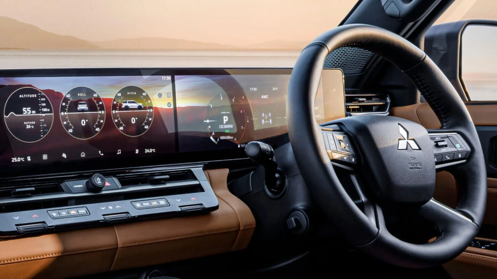 Dual 14.3-inch displays in the 2027 Mitsubishi Pajero showing the Multi-Meter with pitch and roll readouts