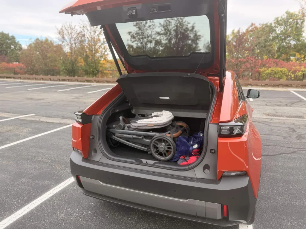 2026 Subaru Uncharted trunk open with a folded full-size stroller inside