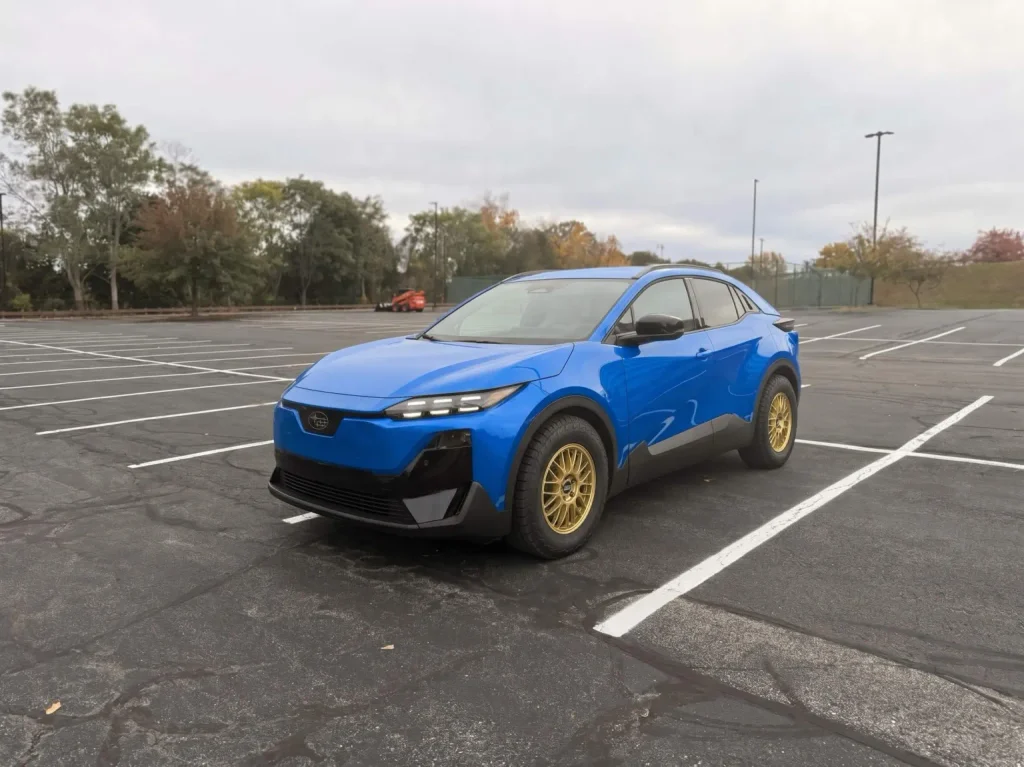 2026 Subaru Uncharted rendered in World Rally Blue on gold wheels