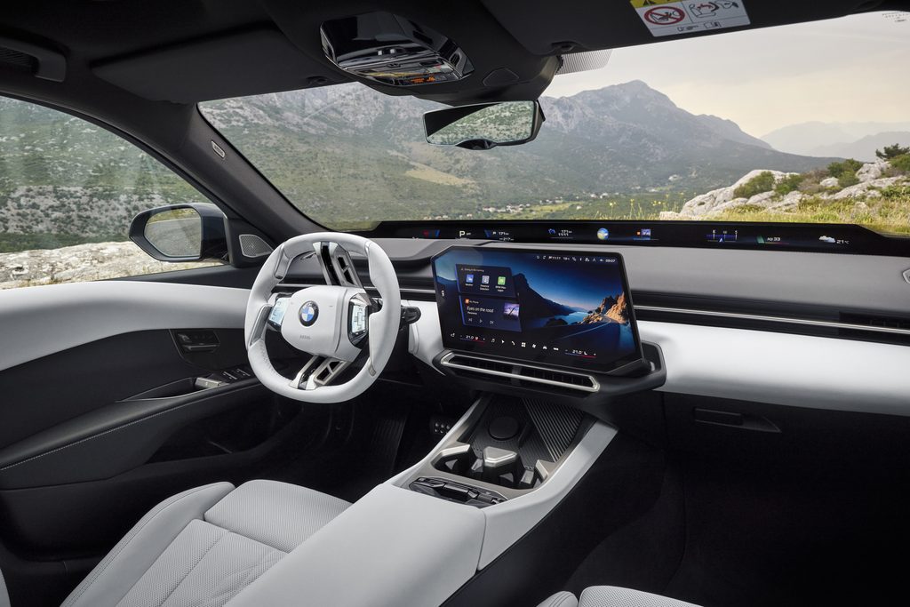 BMW 320 interior with light upholstery and the Panoramic Vision display strip