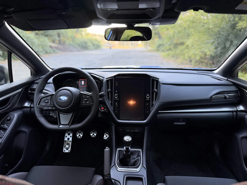 2026 Subaru WRX base interior with 11.6-inch touchscreen and six-speed manual shifter